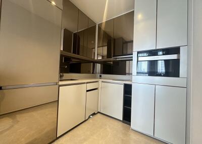 Modern kitchen with white cabinets and built-in appliances