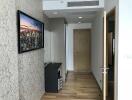 Modern hallway interior with decorative wallpaper and wooden flooring