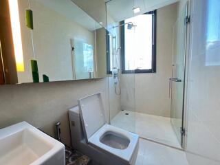 Modern bathroom with glass shower and natural light