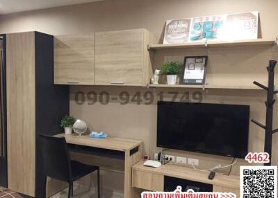 Compact modern living area with entertainment unit and study desk