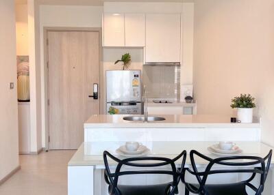 Modern kitchen with dining area in a new apartment