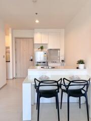 Modern kitchen with dining area in a new apartment