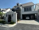 Elegant two-story house with spacious driveway and attached garage