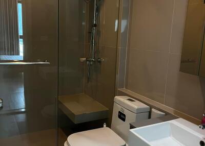 Modern bathroom with glass shower and toilet
