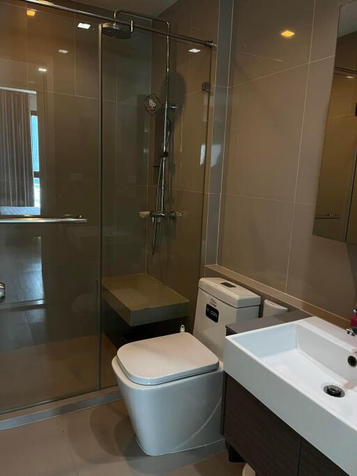 Modern bathroom with glass shower and toilet