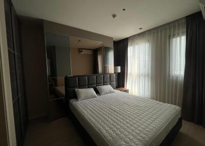 Modern bedroom with large bed and elegant interior design