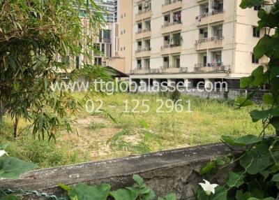 Urban apartment building behind greenery