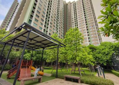 Landscaped communal garden with play area in a residential complex