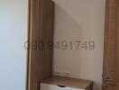 Compact bedroom with wood furniture and air conditioning unit