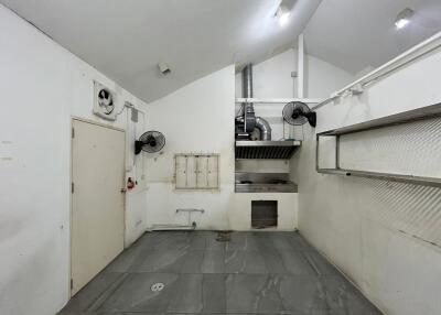 Spacious clean garage with white walls and grey flooring