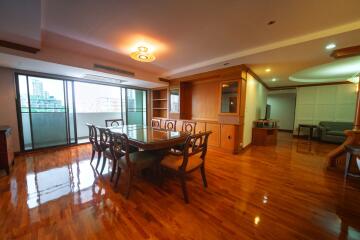 Spacious living room with dining area and hardwood floors