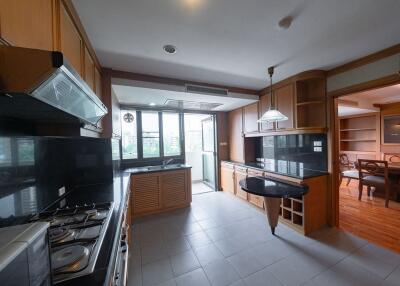 Spacious kitchen with wooden cabinets and modern appliances