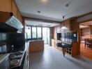 Spacious kitchen with wooden cabinets and modern appliances