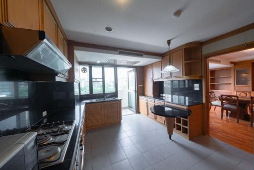 Spacious kitchen with wooden cabinets and modern appliances