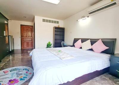 Spacious bedroom with king-sized bed and modern amenities