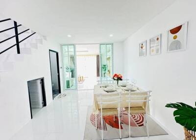 Bright and modern dining area with table set for four