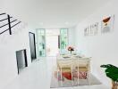 Bright and modern dining area with table set for four