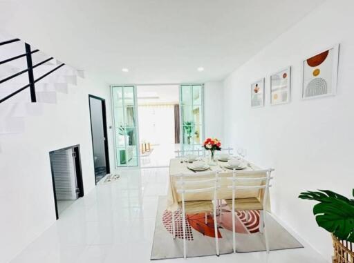 Bright and modern dining area with table set for four