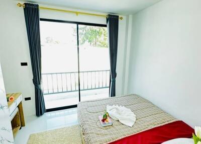Modern furnished bedroom with natural light