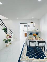 Stylish dining area with decorative tiled flooring and staircase