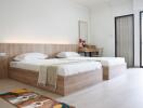 Bright and spacious bedroom with twin beds and wooden furnishings