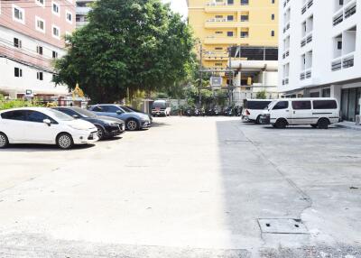 Spacious outdoor parking lot with multiple vehicles