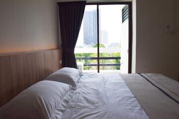 Bright bedroom with a view of the city