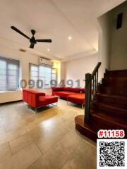 Spacious living room with natural light and modern furniture