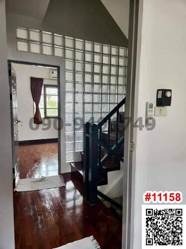 Entrance view with staircase and glass block partition