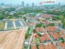 Aerial view of a residential area showing both a developed housing estate and surrounding community