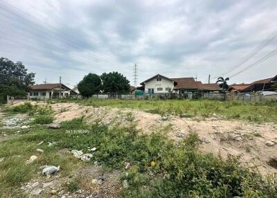 Vacant land plot with potential for development under a cloudy sky