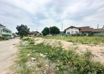 Empty building plot with potential for property development surrounded by residential area