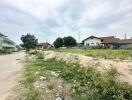 Empty building plot with potential for property development surrounded by residential area