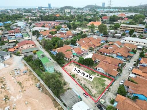 Aerial view of a residential plot for sale outlined in red