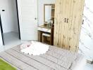 Modern styled bedroom with a comfortable bed and wooden wardrobe
