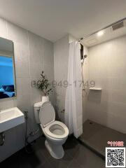 Modern bathroom with white tiles and shower curtain