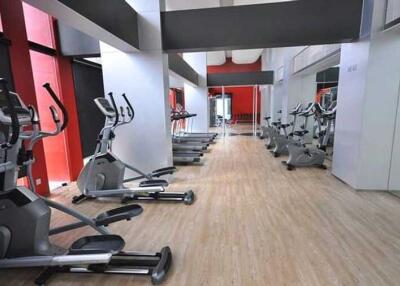Modern gym with exercise equipment in a residential building