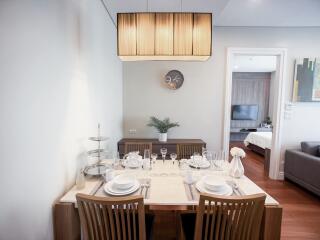 Modern dining room with table set for a meal