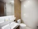 Modern bathroom interior with white and beige tile walls