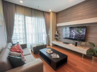 Modern living room with ample seating and a large television