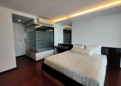 Spacious bedroom with modern design and ambient lighting