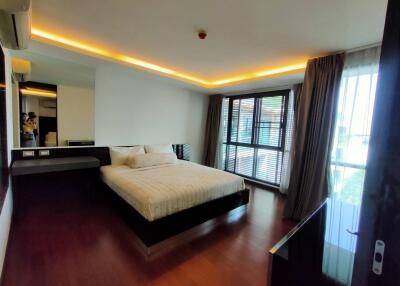 Spacious bedroom with modern design and large windows