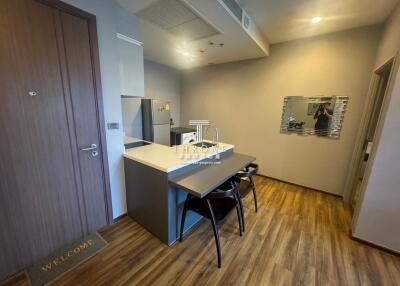 Modern kitchen with dining area and hardwood flooring