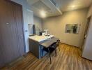 Modern kitchen with dining area and hardwood flooring