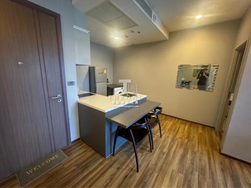 Modern kitchen with dining area and hardwood flooring