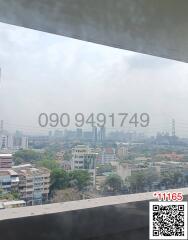 Cityscape view from a high-rise building balcony with contact information overlay