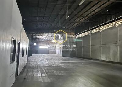 Spacious industrial warehouse interior with high ceiling