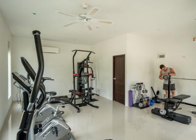 Spacious home gym with exercise equipment