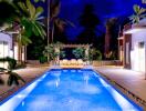Luxurious outdoor swimming pool area with a night view, surrounded by palm trees and lounge chairs