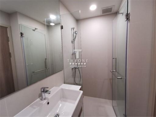 Modern bathroom interior with glass shower cubicle